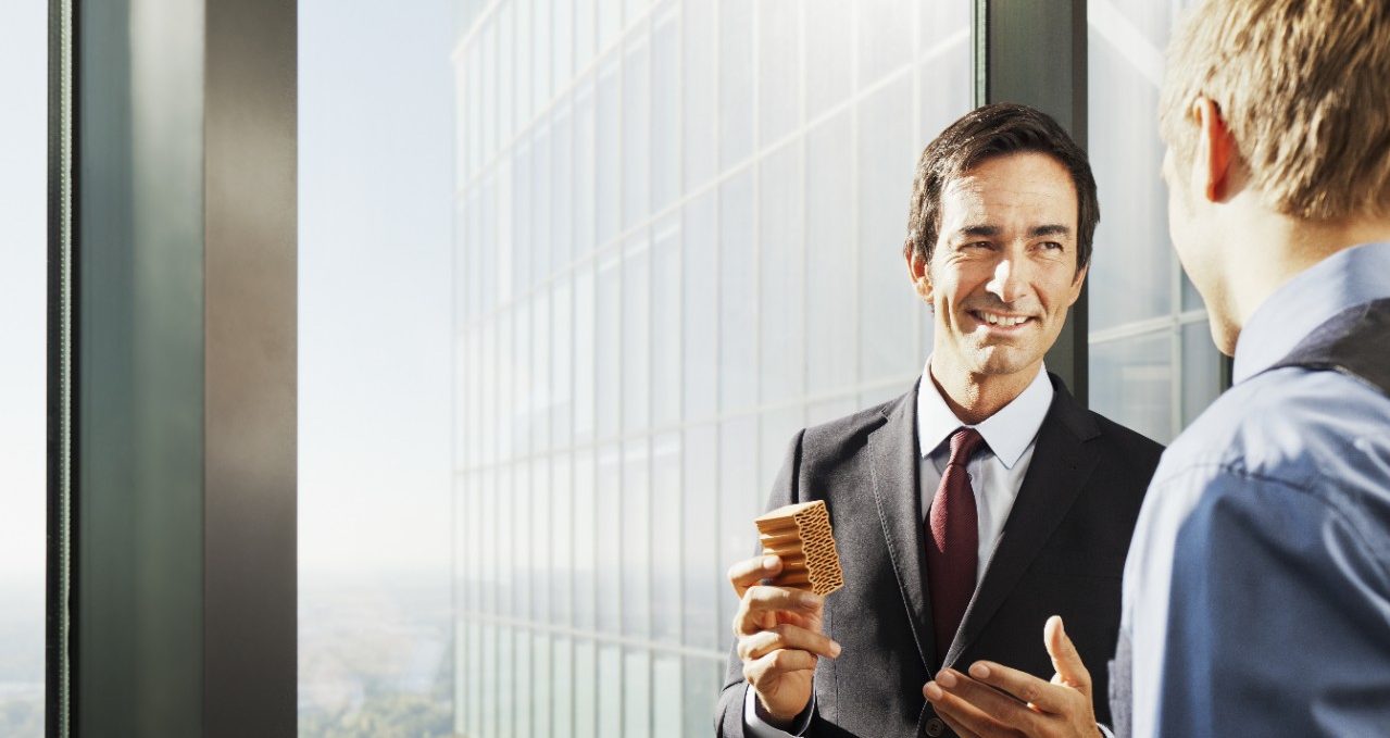 Business people inside high-rise building with a stunning view