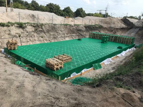 Nearly completed stormwater infiltration tank from Stormbox II crates nearby the railway line | Pipelife